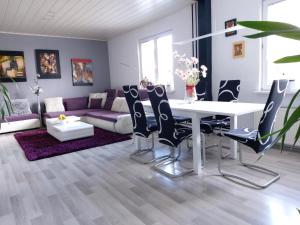 a living room with a white table and chairs at Holiday Home Livada in Ljubljana