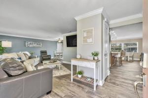a living room with a couch and a table at Fleming Ct Pool Home - Palm Coast in Palm Coast