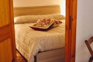 A bed or beds in a room at Casa Sant'Anna