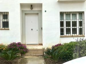 The facade or entrance of Manilva Townhouse with spectacular views of Gibraltar
