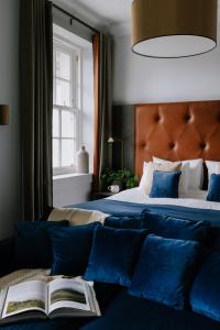 
a bedroom with a bed and a lamp at Native Glasgow in Glasgow
