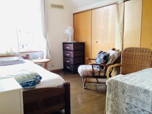 Postel nebo postele na pokoji v ubytování 民泊 B&B yoshida