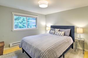 a bedroom with a bed and a window at Renovated Kingston Home Game Room and Deck! in Kingston