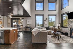a living room with a couch and a table at Whiskey Hills At Terry Peak in Lead