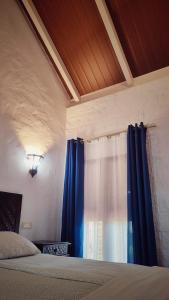 Postel nebo postele na pokoji v ubytování Hacienda Sajorami