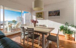 a dining room with a table and chairs and a couch at Casa del Mar in La Herradura