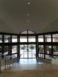 an empty building with a staircase and windows at Appartement en bord de mer in Cannes