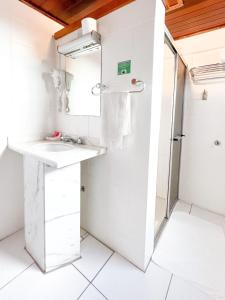 Kuchyň nebo kuchyňský kout v ubytování Hotel das Rosas