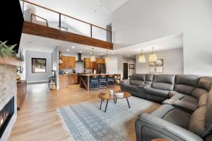 a living room with a couch and a table at Copper Skies Lodge at Powder House Pass in Lead