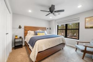 a bedroom with a bed and a window at Copper Skies Lodge at Powder House Pass in Lead