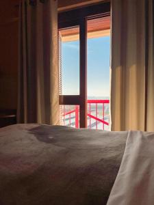Postel nebo postele na pokoji v ubytování Hotel das Rosas