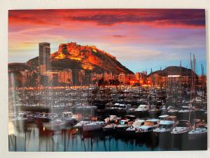 a view of a city with boats in a marina at Apartamento 29th floor & sea view in Alicante