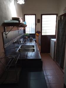 a kitchen with a sink and a counter top at Casa en Playas de Oro in San Antonio de Arredondo