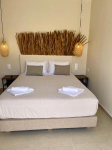 Postel nebo postele na pokoji v ubytování Atma Beach Rooms & Suites
