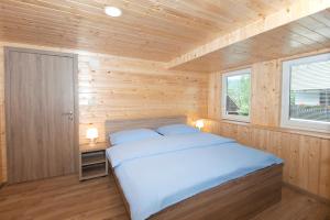 Postel nebo postele na pokoji v ubytování Zotlar House