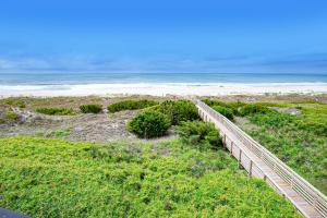 a view of a beach with a wooden fence at ABPAB89 A Place at the Beach 355 in Atlantic Beach