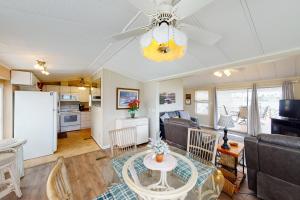 a living room with a table and a kitchen at Long Island Village Unit 347 in Port Isabel