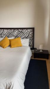 Postel nebo postele na pokoji v ubytování Appartamento Palazzo dei Duchi