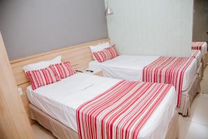 Postel nebo postele na pokoji v ubytování Grande Hotel Ipatinga