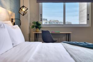 Postel nebo postele na pokoji v ubytování Arcade Hotel Athens