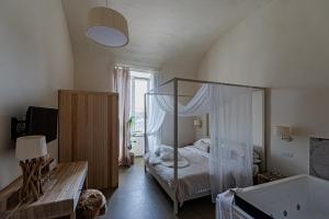 En eller flere senger på et rom på Terra Mia Suite