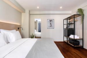 Postel nebo postele na pokoji v ubytování Arcade Hotel Athens