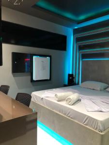 Ένα ή περισσότερα κρεβάτια σε δωμάτιο στο Up Motel