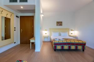 a bedroom with a bed and a hallway with a door at Villa Królewiec - 1,5km od Energylandii in Zator