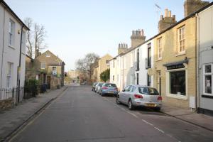 a street with cars parked on the side of the road at Cambridge city centre immaculate 2 bed apartment in Cambridge