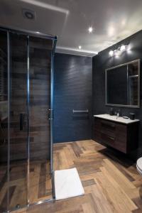 a bathroom with a shower and a sink at ZEPPELIN APARTMENTS Simple Acomodation in Jelenia Góra