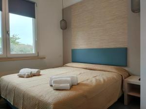 En eller flere senge i et værelse på APFEL AR holiday-home
