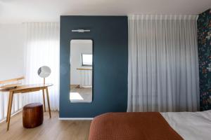 A bed or beds in a room at Gallerita