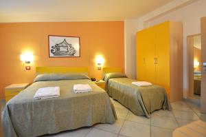 Postel nebo postele na pokoji v ubytování Victoria Resort