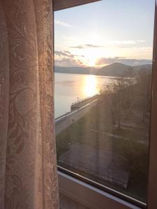 a view of a sunset from a window at Dunavska panorama in Golubac