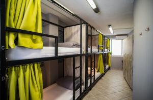 A bed or beds in a room at Bedway Athens Hostel