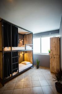 A bed or beds in a room at Bedway Athens Hostel