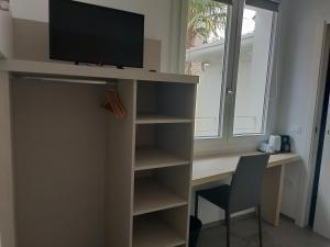 Televízia a/alebo spoločenská miestnosť v ubytovaní APFEL AR holiday-home + 20 fotografií