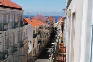 a view of a city street with buildings at Casa Onda Spot in Nazaré
