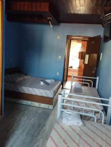 Postel nebo postele na pokoji v ubytování Hotel Palace Vila Sônia