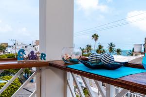 a balcony with a view of the ocean at Summer Breeze in San Andrés