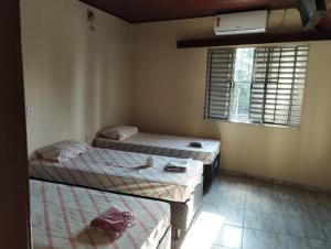 Katil atau katil-katil dalam bilik di Hotel Palace Vila Sônia