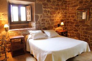 Postel nebo postele na pokoji v ubytování Hostal Rural Ioar