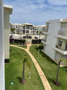 Gallery image of Bel appartement pied sur mer vue imprenable sur piscine et jardins in Sidi Rahal