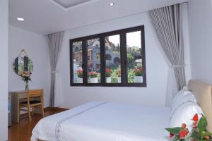 Postel nebo postele na pokoji v ubytování Hotel Pansy