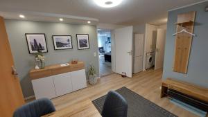 a living room with a kitchen and a living room with a living room at Ferienwohnung Esther in Singen