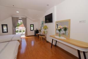 TV a/nebo společenská místnost v ubytování Hotel Pansy + 27 fotografií