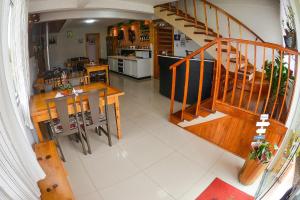 an aerial view of a kitchen with a table and stairs at Pousada Gianisella in Bom Jardim da Serra