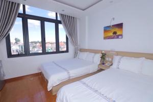 Postel nebo postele na pokoji v ubytování Hotel Pansy