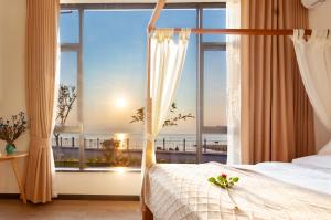 Postel nebo postele na pokoji v ubytování Blue Sea Hotel