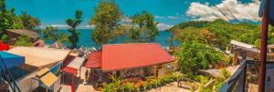 an aerial view of a town with a red roof at CANIBAD SECRET PARADISE RESORT in Aumbay